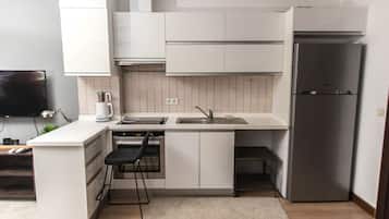 Apartment | Private kitchenette | Full-size fridge, oven, stovetop, dishwasher