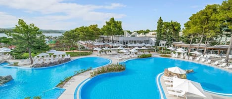2 outdoor pools, open 8:00 AM to 8:00 PM, pool umbrellas, pool loungers