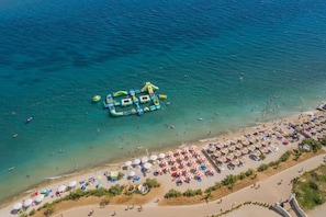 Beach nearby, white sand, beach cabanas, beach towels