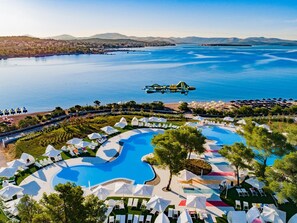 A resort with multiple swimming pools, a beach area, and a view of the sea. - Amadria Park Kids Hotel Andrija (Sibenik)