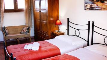 Quadruple Room, Private Bathroom (External) | Individually decorated, individually furnished, desk, bed sheets