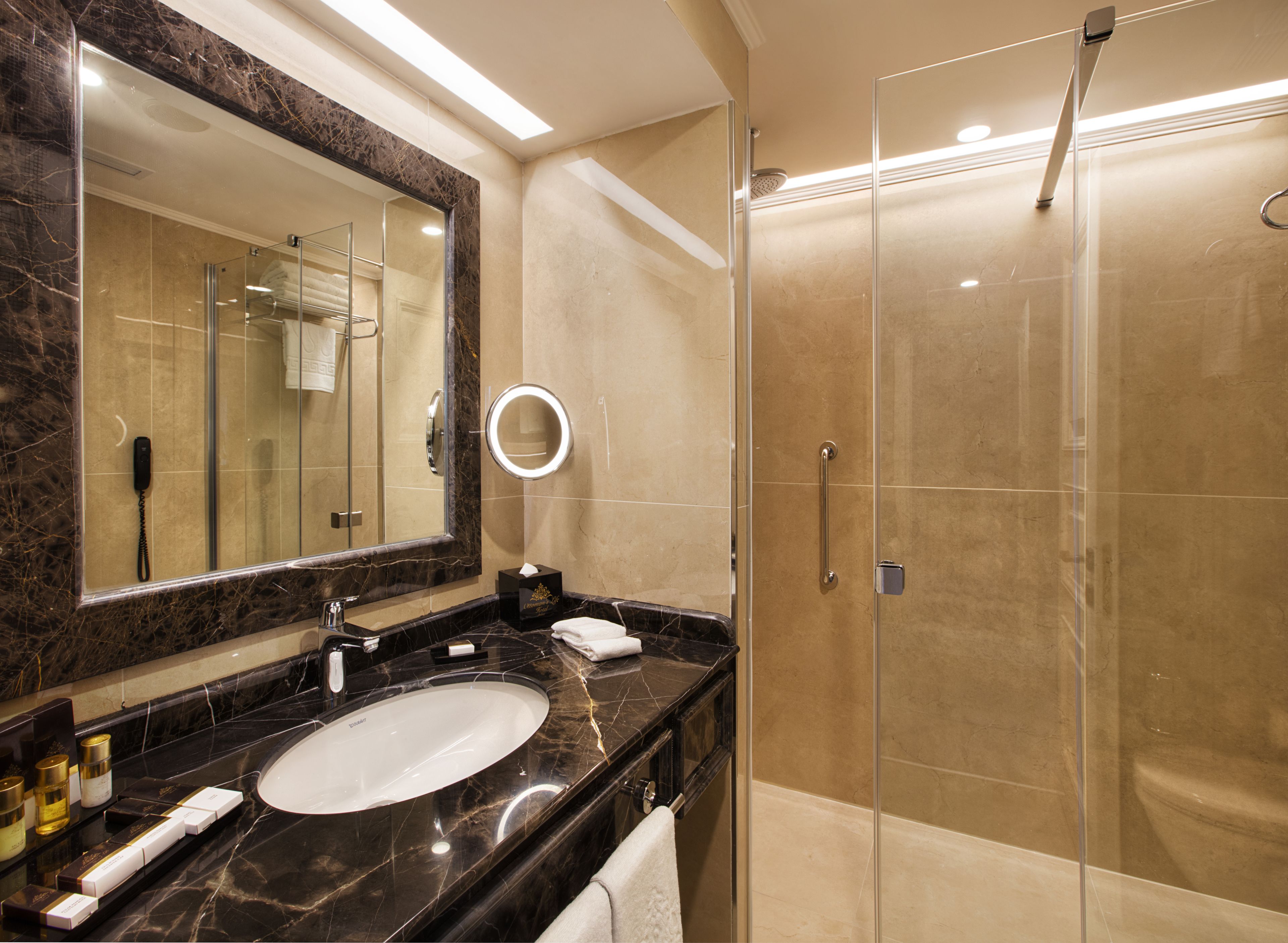 designer toiletries, hair dryer, bathrobes, slippers