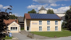 A building with a sign reading "EINSIEDL" and "Pension EINSIEDL" on its facade. - Pension Einsiedl (Ottenschlag)