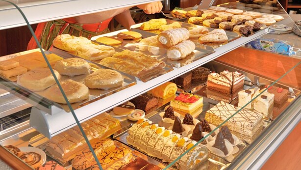 A bakery display case filled with various pastries and desserts. - Pension Einsiedl (Ottenschlag)