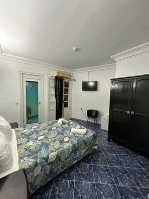 Basic Double or Twin Room, Smoking, Partial Sea View | Minibar, desk, iron/ironing board, rollaway beds