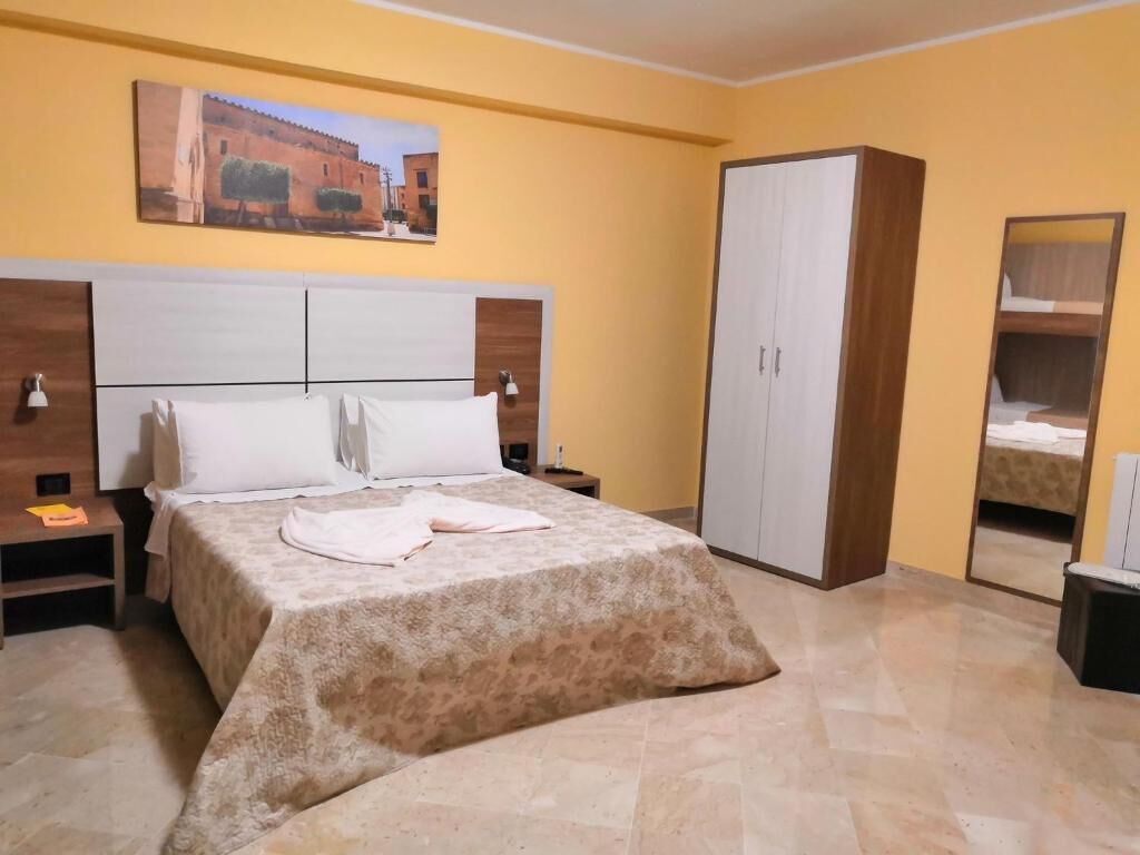 Classic Quadruple Room, Multiple Beds, Non Smoking | Minibar, in-room safe, free WiFi, bed sheets