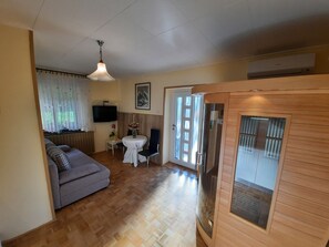 Comfort Apartment, 1 King Bed with Sofa bed, Sauna, Hill View | Living area | Flat-screen TV, heated floors -  Apartment Zonir with sauna (Kobarid)