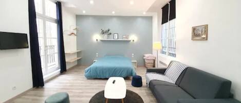 Superior Apartment | Living area | 36-inch LED TV with cable channels, TV, iPod dock