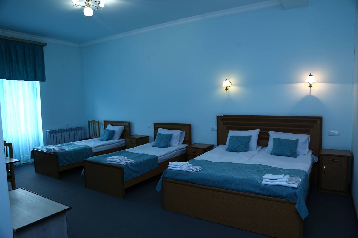 Standard Quadruple Room, Balcony | In-room safe, desk, blackout drapes, WiFi (free)
