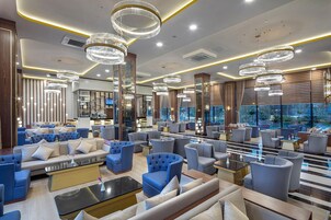 5 bars/lounges, poolside bar, beach bar