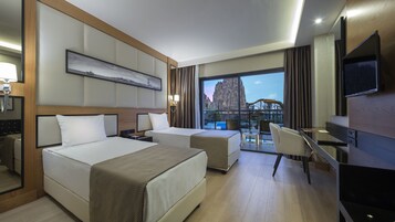 Family Room | Free minibar, in-room safe, desk, laptop workspace