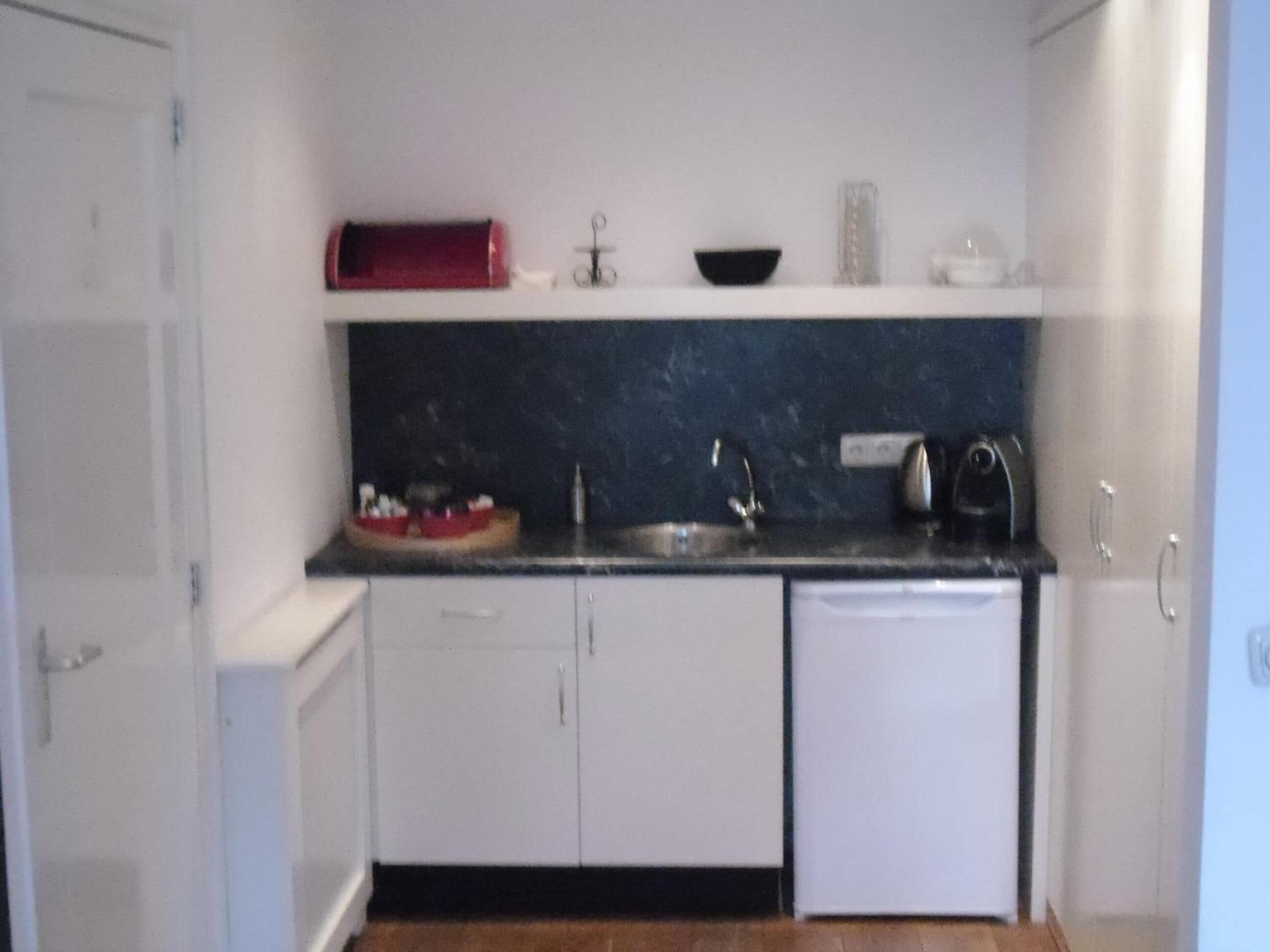 full-sized fridge, espresso maker, coffee/tea maker, electric kettle