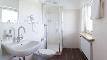 Shower, free toiletries, hair dryer, towels
