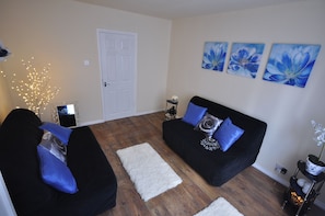 Basic Apartment, 3 Bedrooms | Living room | 32-inch flat-screen TV with digital channels, TV