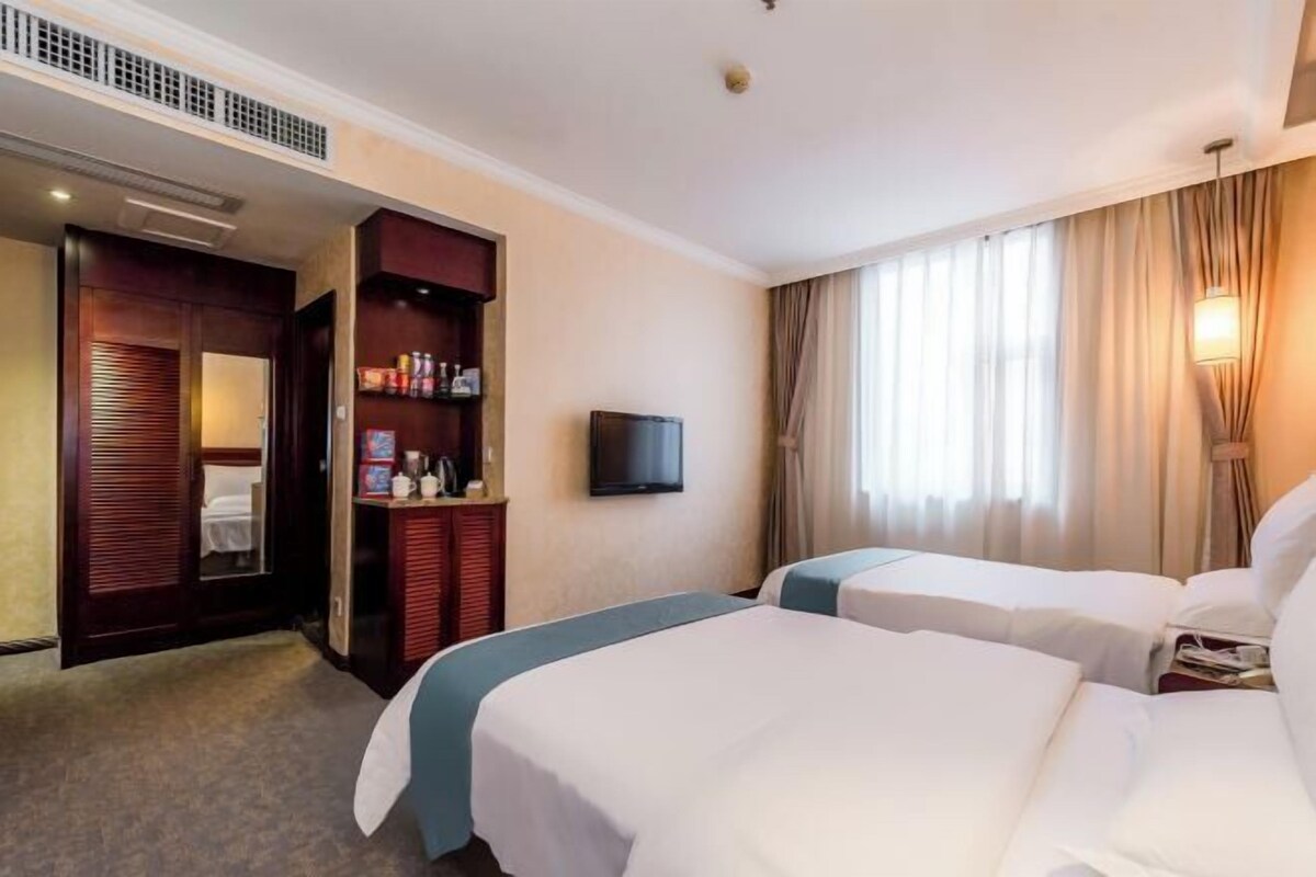 Minibar, desk, blackout drapes, bed sheets