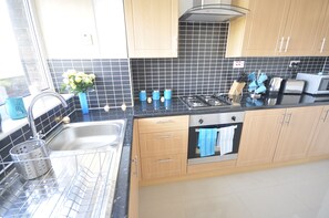 Basic Apartment, 2 Bedrooms | Private kitchen | Full-sized fridge, microwave, oven, stovetop
