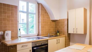 Full-size fridge, stovetop, espresso maker, coffee/tea maker