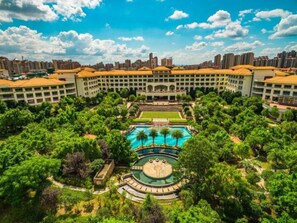 A hotel with a central courtyard, a swimming pool, and surrounding greenery. - Jinjiang International Hotel Ganzhou (GANZHOU)