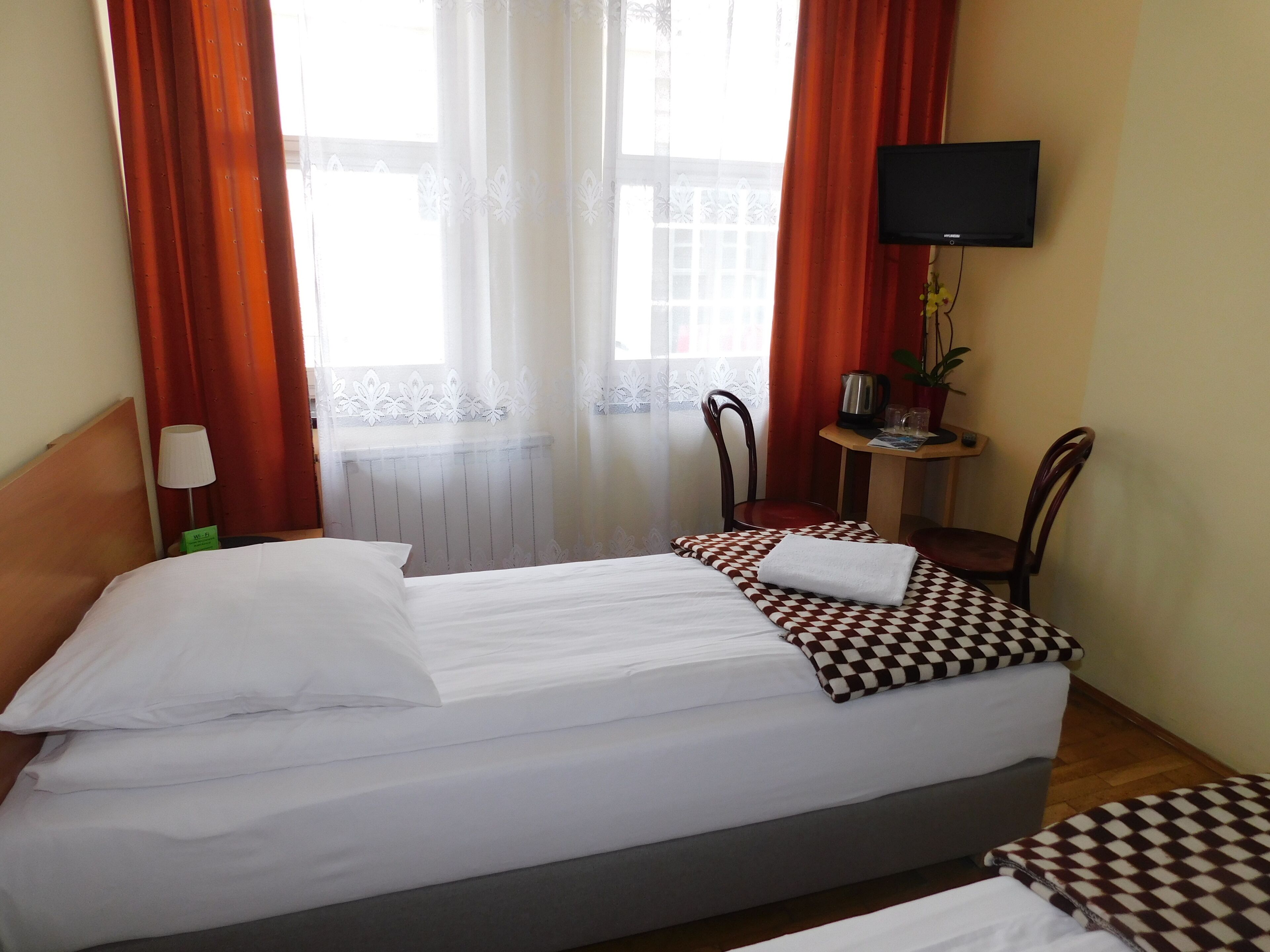 basic twin room | in-room safe, iron/ironing board, free wifi, bed sheets