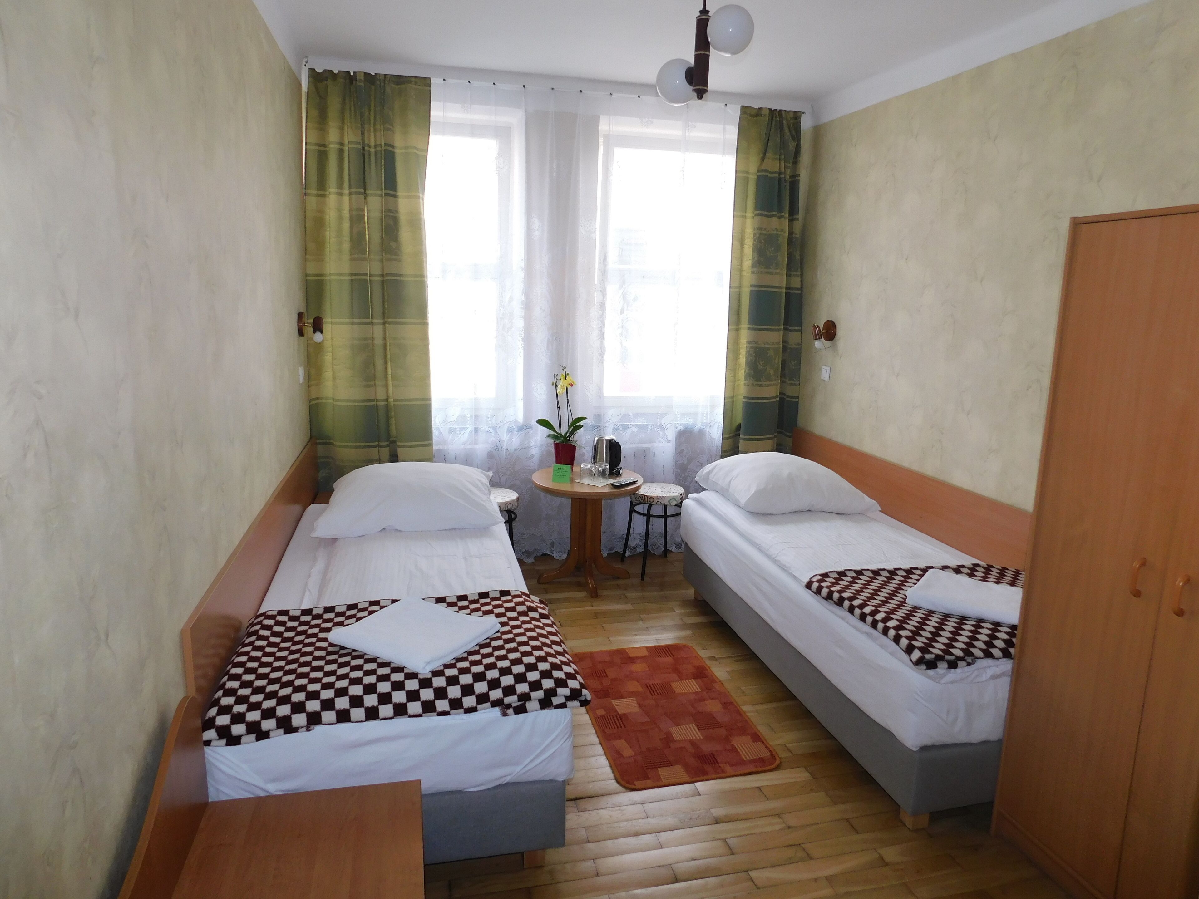 basic twin room | in-room safe, iron/ironing board, free wifi, bed sheets