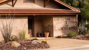A rustic building with a sign reading "KAYEL BAR & GUEST RANCH". - Kay El Bar Guest Ranch (Wickenburg)