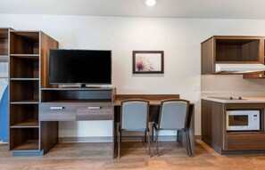 Desk, laptop workspace, blackout curtains, iron/ironing board