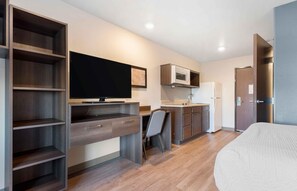 A compact bedroom with a bed, a desk, and a chair. - Extended Stay America Suites - Minneapolis - Airport - Mendota Heights (Mendota Heights)