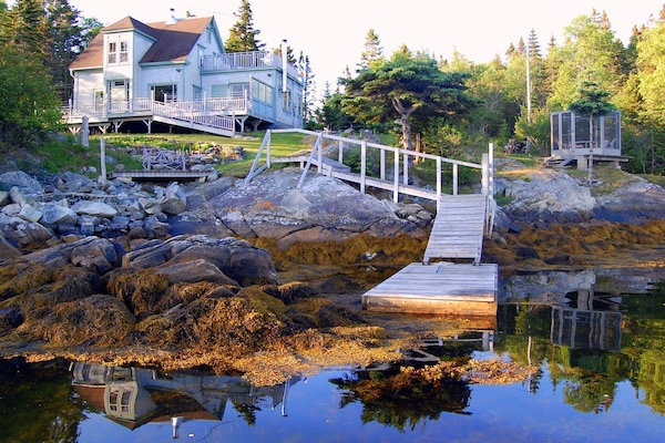 We sit on a pretty, secluded cove. Accessible by car. Dock may not be available.