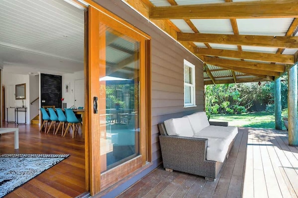 A modern interior with a glass door leading to a patio area.