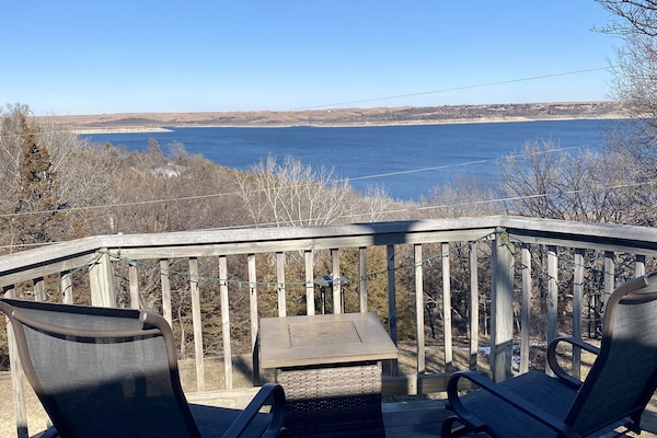 Full View of Lake from back deck with gliders, gas fire pit and grill