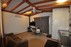 Cabin, 1 Queen Bed, Jetted Tub | Living area | TV