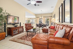 Flat-screen TV, video game console, DVD player, table football