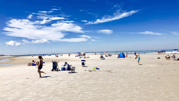 A beach with people, umbrellas, and beach chairs. - Walk to the Beach, Heated Salt Water Pool, Central AC (Dennis)