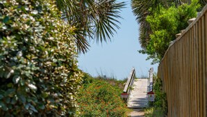 A pathway leading to a wooden bridge with a sign indicating no parking. - Mountain to Sea - Direct Beach Access -Ocean Views - 4BD +Bonus Bedroom (Folly Beach)