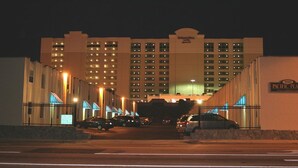 A large hotel with multiple floors and a prominent sign reading "SpringHill Hotel". - Great Location ! 1 Short Block To The Boardwalk. (Virginia Beach)