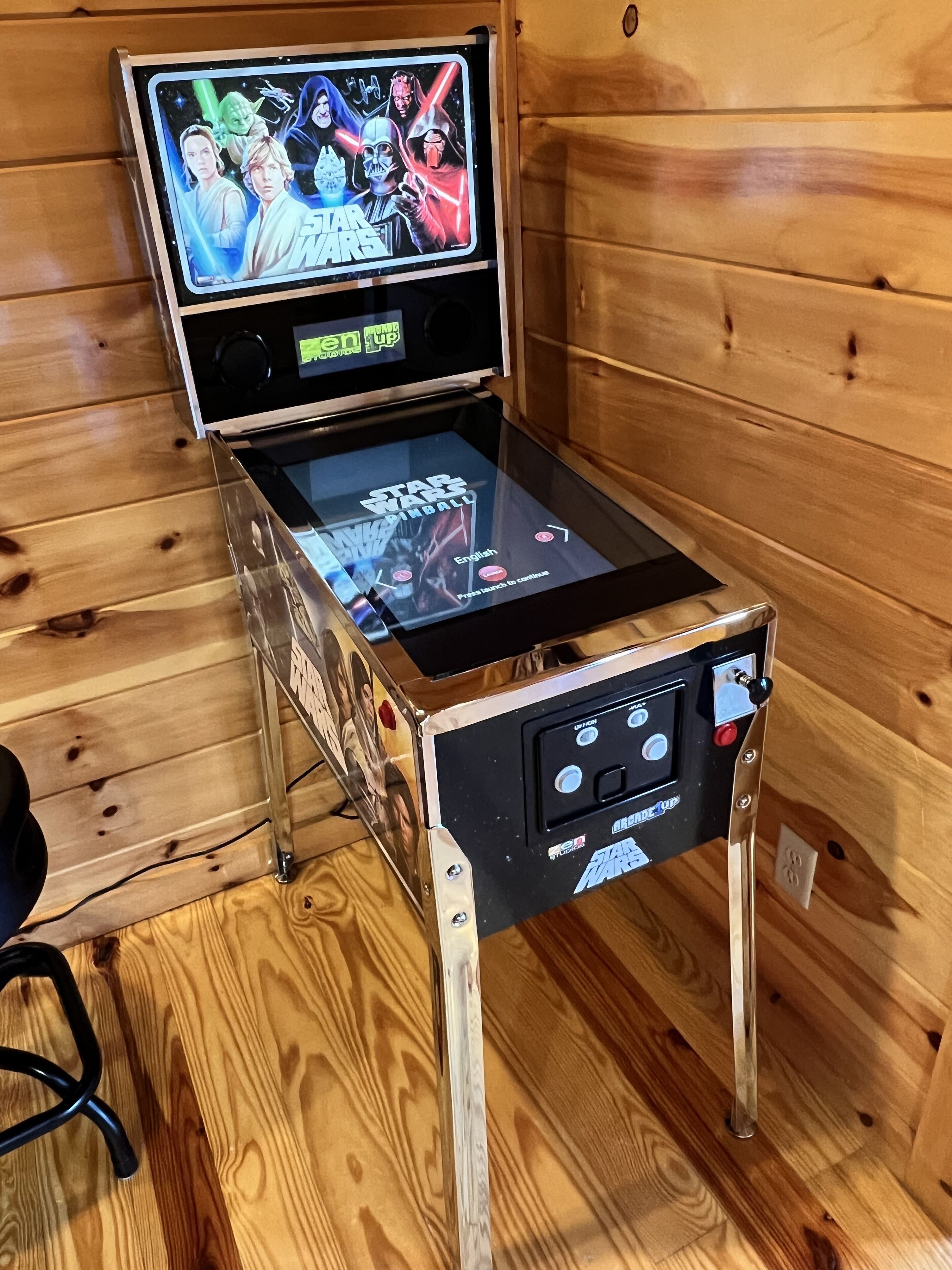 A Star Wars themed gaming setup with a monitor and console.