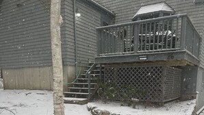 A two-story house with a covered porch and a stone staircase leading to the entrance. - Mount Desert Island, Bar Harbor, Acadia National Park (Bar Harbor)