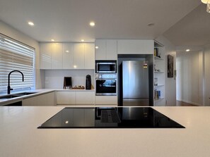 Microwave, stovetop, dishwasher, eco-friendly cleaning products - Beach Days Townsville - Spacious Strand Apart. - Beach Days Townsville - Spacious Strand Apart. (North Ward)