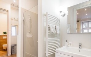 Bathtub, hair dryer, towels, soap