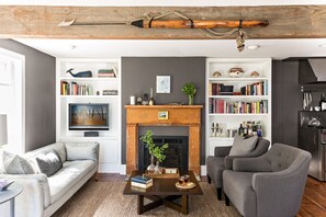 LCD TV, fireplace, books, stereo