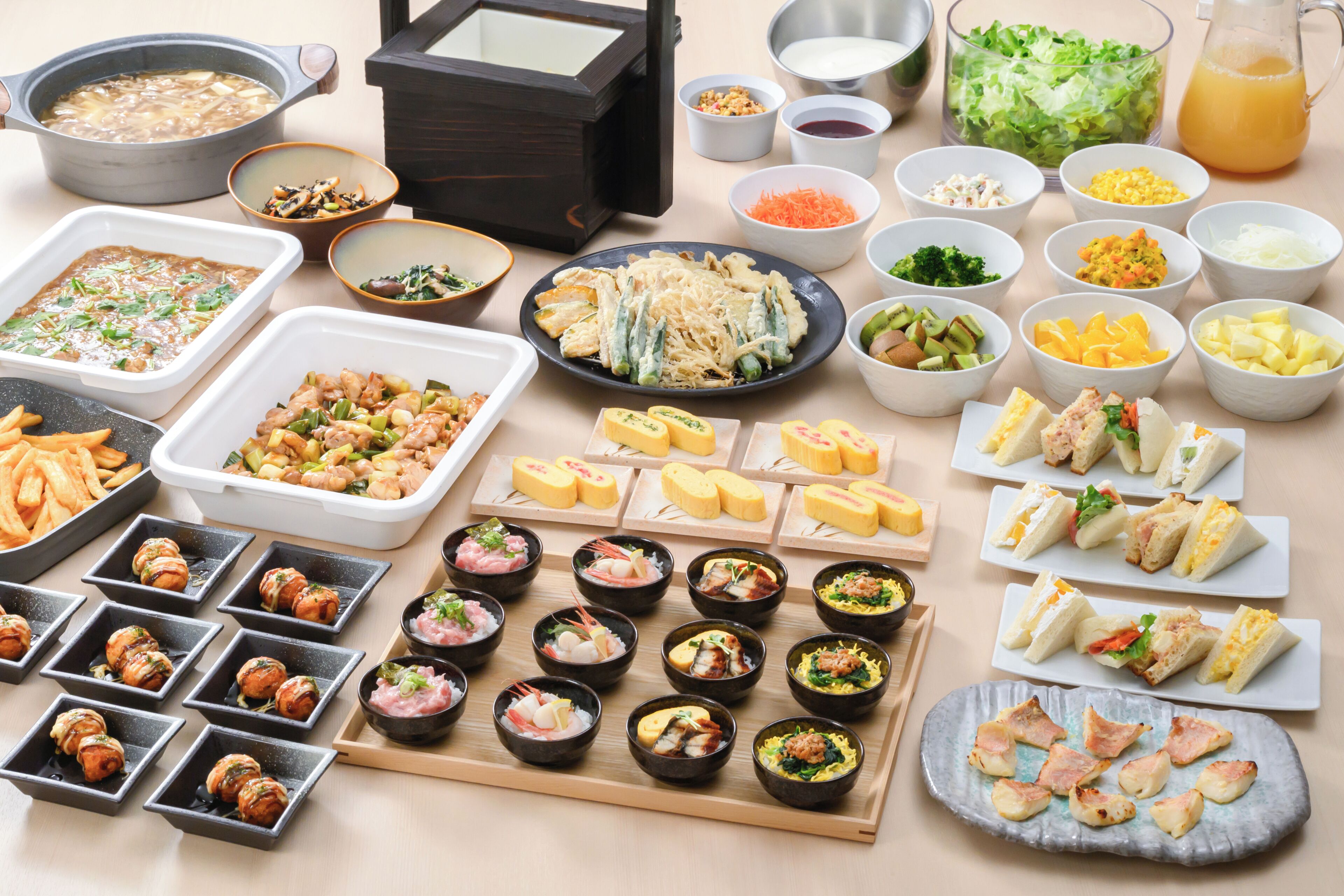 A variety of food dishes and bowls on a table.