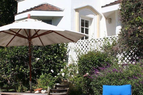 Private cottage with patio table and lounge chair