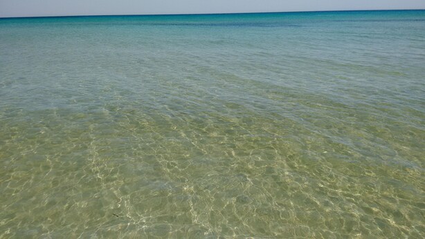 A clear view of a shallow water body with a distant horizon. - Noto Lido (Syracuse Sicily Italy), Adriana Residence on the Beach by the Sea !!! (Lido di Noto)