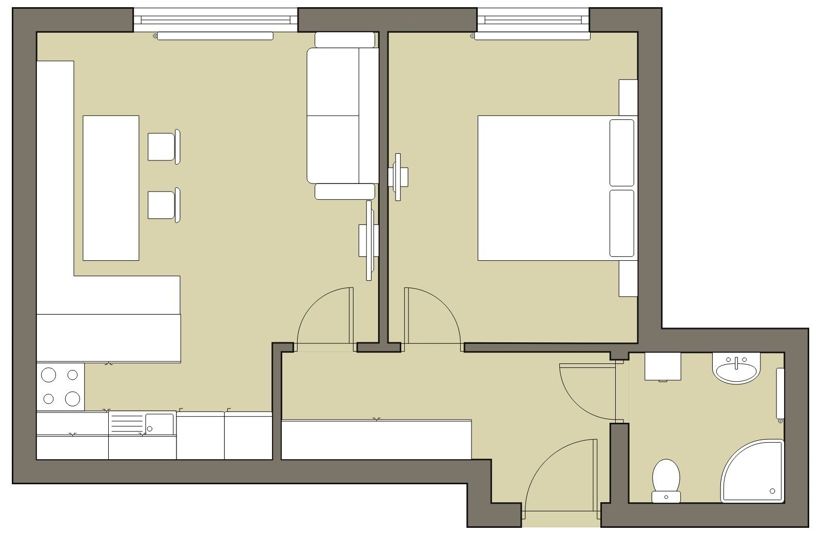 Un plan d’étage d’une chambre d’hôtel comprenant un coin cuisine, une salle de bain et un espace de vie.