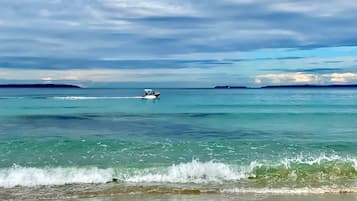 On the beach, sun-loungers