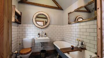 Bathtub, hair dryer, towels, soap