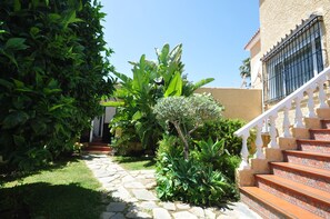 Stroll through lush gardens to the entrance of this traditional building.