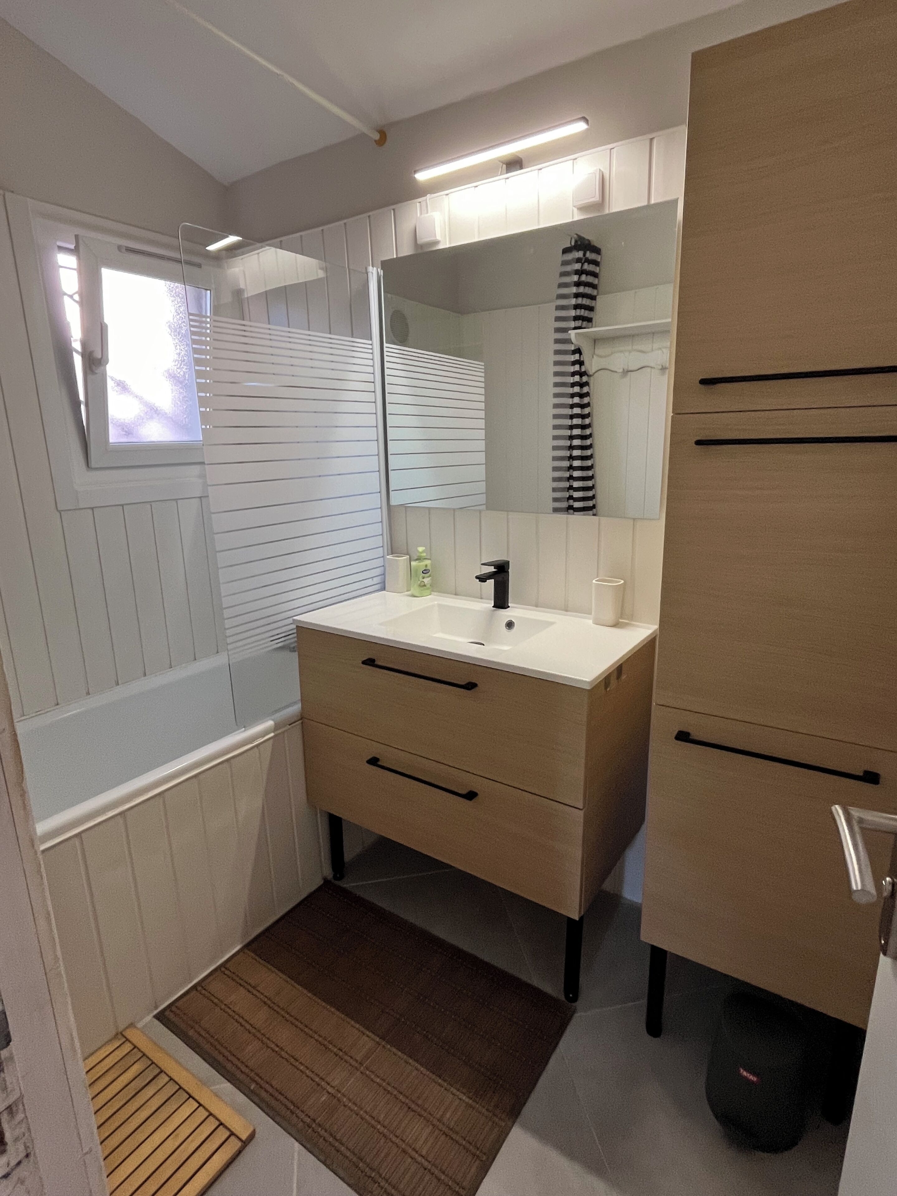 Bathtub, hair dryer, towels, soap