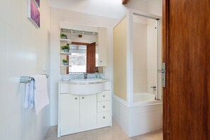 Bathtub, hair dryer, towels