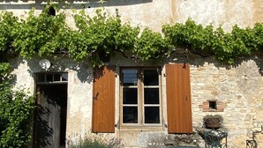 A rustic stone building with wooden shutters, a small window, and a chimney. - Charming, Detached Farmhouse With Private Swimming Pool. (Lizant)